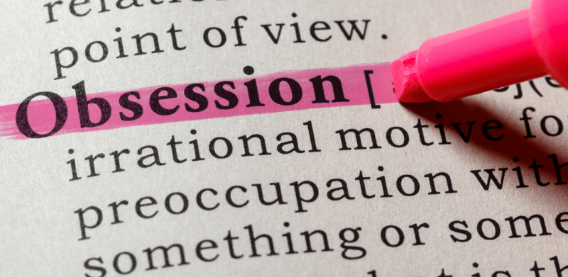 word obsession highlighted in pink in a textbook