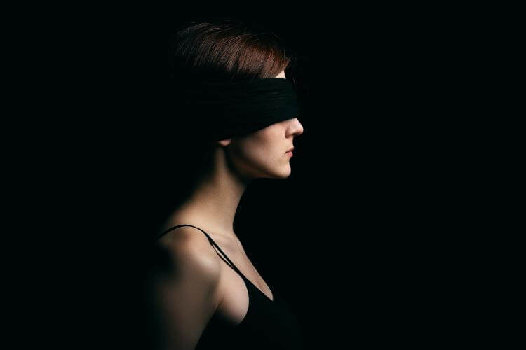 Profile woman with a blindfold on